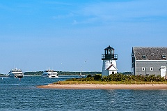 Ferries  By Hyannis Harbor Lighthouse on Cape Cod